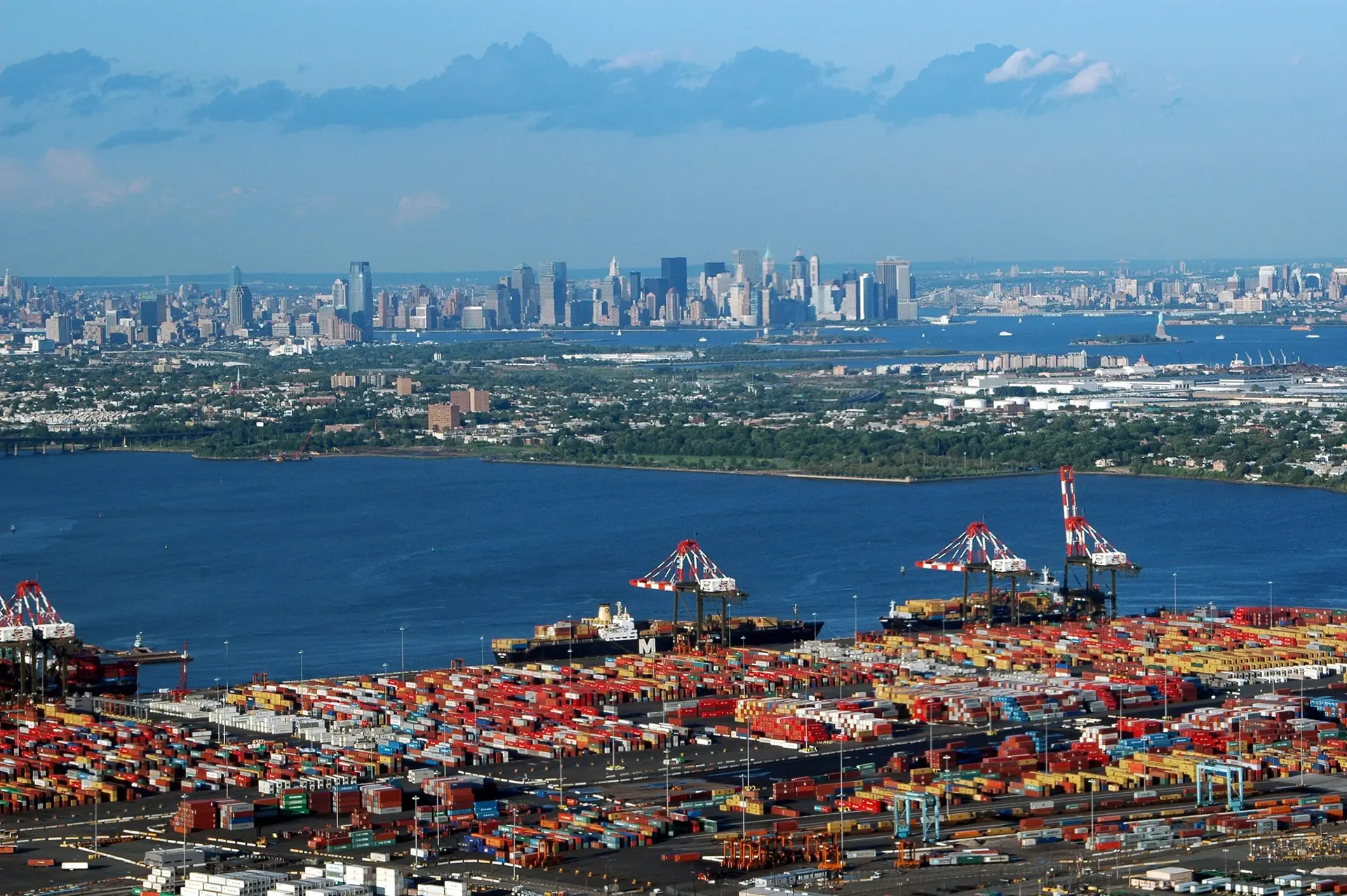 Port Newark-Elizabeth container terminal and Newark Bay from the air, with the Manhattan skyline on the horizon.